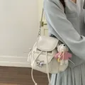 Sweet cream white mini backpack featuring a silver bow charm and a plush bear pendant. - White (With Charm)
