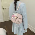 Stylish pink commuter backpack for girls featuring a cute white bear plush charm - Pink (With Charm)