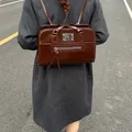 Vintage dark brown faux leather commuter backpack with polished silver hardware detail - No Pendant / Burgundy
