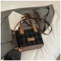 Chic retro black diamond pattern bucket bag featuring brown leather trim and top handles - No Pendant / Black