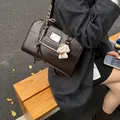 Dark brown PU leather commuter backpack for women with a cute plush poodle charm - With Pendant / Coffee