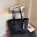Professional large capacity black commute tote bag with stylish beaded charm detail - With Pendant / Black