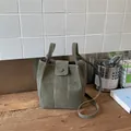 Moss green faux leather bucket bag with contrast stitching and thin shoulder strap. - Basic Style / Green