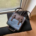 Zaino retrò in denim blu e pelle marrone con fibbia e manico superiore robusto - Tipo standard / Blu