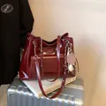 Vintage large capacity tote bag in dark red glossy leather with chain strap for women - With Pendant / Burgundy