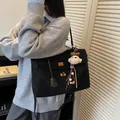 Elegant vintage matte black suede-textured commuter tote bag with gold lock hardware - With Charm / L / Black