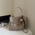 Vintage beige suede crossbody satchel bag for women featuring a plush dog charm - With Charm / L / Gray