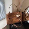 Retro brown suede handbag with plush puppy charm for commuting, stylish crossbody bag - With Charm / L / Brown