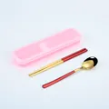 Portable red and gold stainless steel cutlery set with a pink storage box for travel - Rose Gold Red