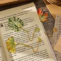 Exquisite leaf-shaped metal bookmarks with ginkgo and monstera designs in SKU detail - 2 Pcs/Set / Monstera And Ginkgo