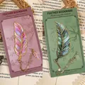 Elegant metal feather bookmarks in gradient pink and green variants with gold chains. - Evening Star and Lapis Feather