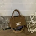 Vintage leopard print brown suede handbag featuring a stylish white duoduo logo - Brown