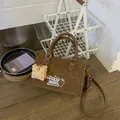 Retro brown suede handbag featuring leopard print and a cute biscuit charm detail - Brown with Pendant