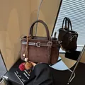 Vintage brown suede crossbody bucket bag for women, perfect for autumn and winter styles - With Pendant / Coffee