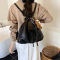 Versatile black large capacity backpack tote for women featuring a cute bear charm - Black With Charm Style (XCY56808)