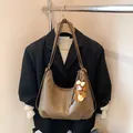 Vintage brown faux leather hobo shoulder bag for women featuring a cute plush bear charm - Brown With Charm Style (XCY56808)