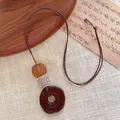 Handmade long wooden geometric pendant necklace with brown braided cord for women - Peace Buckle Ring Style (B)