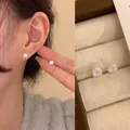 Elegant round sparkling cubic zirconia stud earrings for women displayed in a jewelry box - White Fireworks Screw - 8mm (A2802)