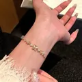 Exquisite gold butterfly flower bracelet with cat-eye stones and rhinestones for women. - Cat Eye Butterfly Floral Style (S836金) / Gold