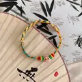 Hand-woven Dragon Boat Festival bracelet featuring colorful rope and pink charm - Single Pink Zongzi (S403 Single Pink Zongzi)