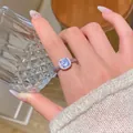 Detailed view of an adjustable silver-colored ring with a sparkling square zircon - Square Rhinestone Open Ring (J1072) / Silver