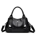 Elegant black soft leather handbag with three compartments and kangaroo logo design - Black