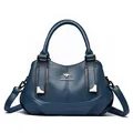Elegant dark blue textured leather handbag with a three-compartment shoulder strap. - Blue