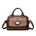Elegant brown leather handbag for women with woven detail and adjustable strap - Brown