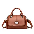 Classic brown textured leather handbag for women featuring braided details and shoulder strap - Yellow