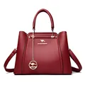 Elegante bolso de mano burdeos de piel con colgante de canguro y asa para mujer - Rojo