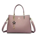 Elegant mauve lychee pattern leather tote bag with gold kangaroo logo and flower charm - Pink