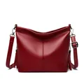 Elegant wine red shoulder bucket bag with tassels and pebble grain texture for women - Burgundy