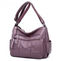 Close-up detail of purple casual crossbody bag with multiple zip pockets - Purple