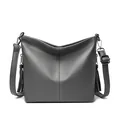 Classic dark grey pebbled texture shoulder bag with stylish side tassels and silver hardware - Gray