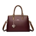 Elegant wine red leather handbag with brown handles and gold kangaroo charm detail - Red/Khaki