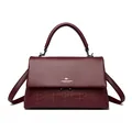 Elegant burgundy leather handbag featuring a gold kangaroo logo and embossed pattern - Burgundy
