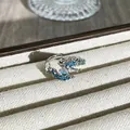 Detailed view of silver dragon ring with blue stones and iridescent opal bead - Colorful Dragon Claw Style (4) / Adjustable Open