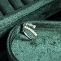 Elegant close-up of a vintage pearl bow ring on luxury green velvet background - No.3 Open Ring (Alternating Pearl Bowknot Style)