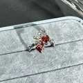 Elegant silver bow-knot open ring featuring a vibrant heart-shaped red stone detail - Style 10 Adjustable Ring