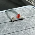Elegant garnet red pear-shaped gemstone open ring featuring sparkling white pavé side stones - Pear-Shaped Zirconia Style (14号) / Adjustable Open / Garnet Red