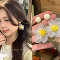 Close-up detail of soft white daisy floral drop earrings for women with nature-inspired design - White (E6939)