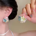 Close-up of elegant floral cluster earrings featuring pastel petals and bead accents - Stud Pin Style / Multicolor (E6925)