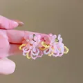 Close-up detail of sweet pink begonia flower beaded earrings with colorful loops. - Pink (E6960)