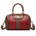 Elegant burgundy and brown contrast faux leather handbag featuring unique braided details - Red