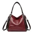 Elegant wine red soft leather tote bag for women with an adjustable brown shoulder strap - Burgundy
