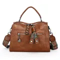 Vintage brown women's Boston handbag with colorful patterned strap and top handle - Brown