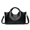 Elegant black pebbled leather handbag featuring top handles and adjustable shoulder strap. - Black
