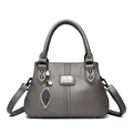 Elegant grey pebbled leather handbag for women, featuring pearl leaf charms and top handles. - Gray