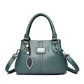 Elegant dark teal faux leather handbag for middle-aged women with leaf charm and handles - Green