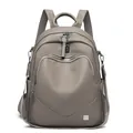 Modern gray soft leather travel backpack for women with textured finish and silver zippers - Earth Gray